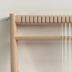 Basic weaving loom pictured with wide spacing