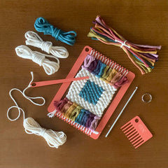 Rainbow frame loom from The Oxford Weaving Studio with a rainbow coaster