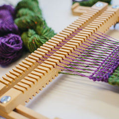 Double-sided heddle bar with two warps on The Oxford Frame Loom