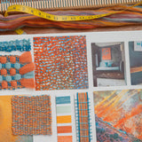 Colourful mood board with textures, patterns and fibres in oranges and blues