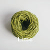 Kilcarra tweed yarn cake with lime colour title across the wool