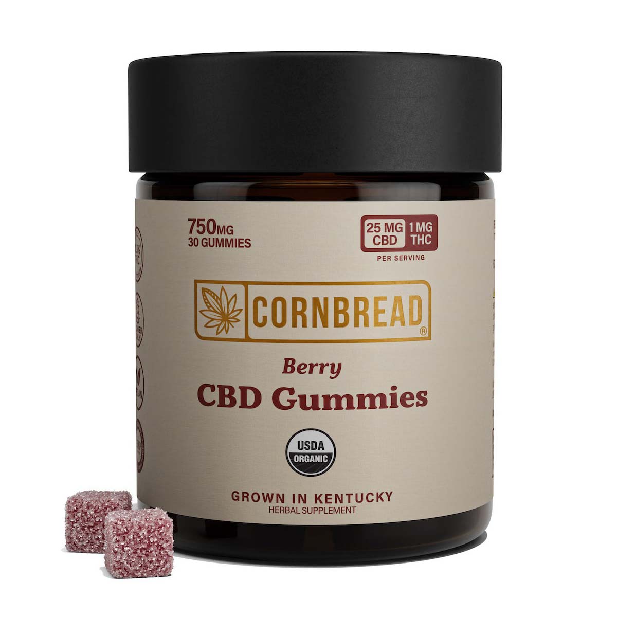 A container of Cornbread Hemp Full Spectrum CBD gummies with two gummies sitting in front of it.