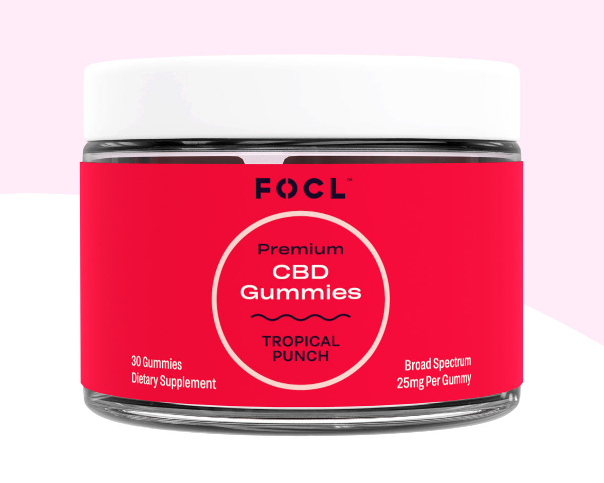 A jar of FOCL Full Spectrum CBD Gummies in Tropical Punch flavor.