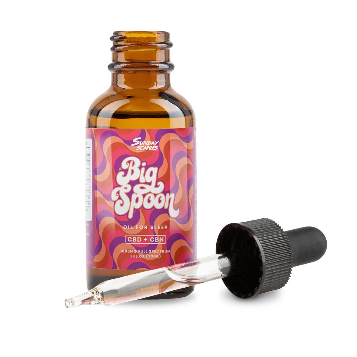 a bottle of Sunday Scaries Big Spoon Sleep Oil with a dropper in front
