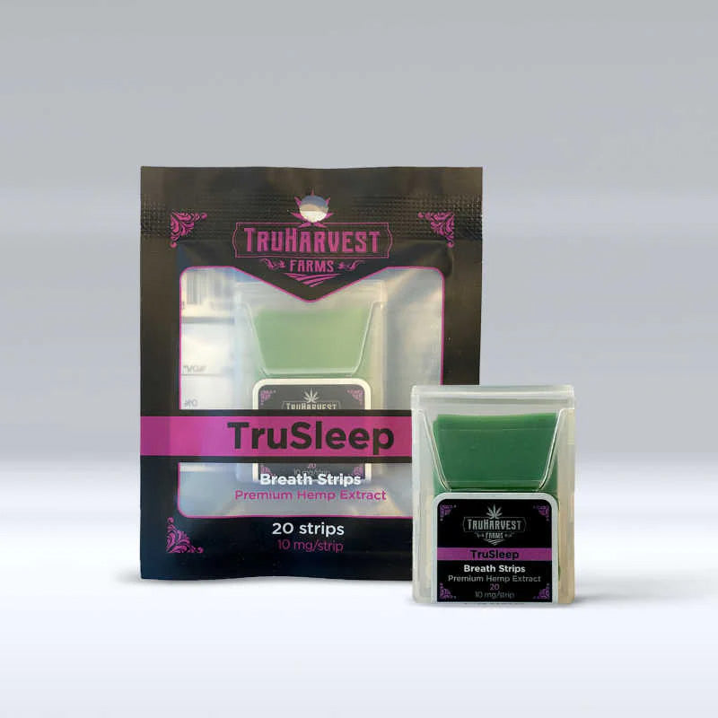 Plastic packages of TruHarvest Farms' TruSleep CBD Sleep Strips with thin green strips