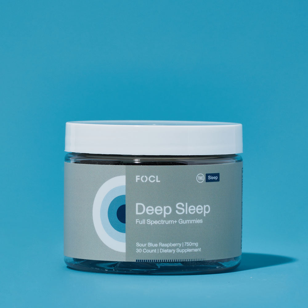 a jar of FOCL Deep Sleep Full Spectrum+ Gummies in Sour Blue Raspberry