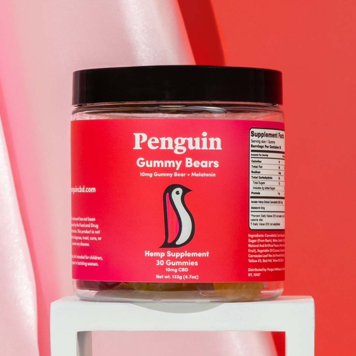 closeup of Penguin CBD gummies in red jar