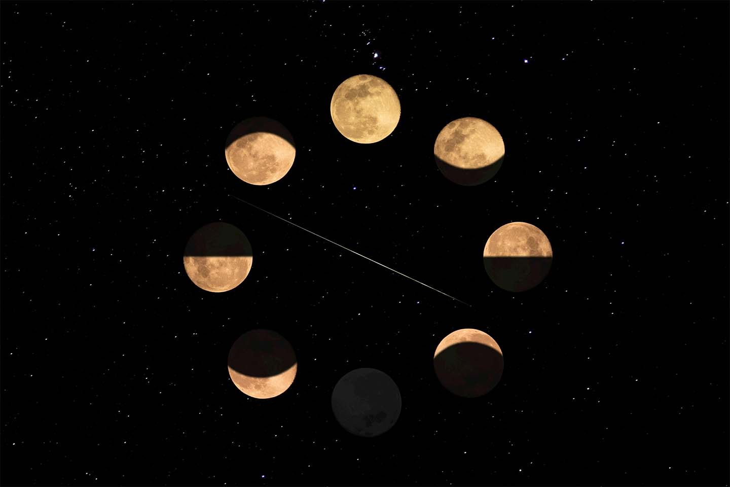 phases of the moon against the night sky