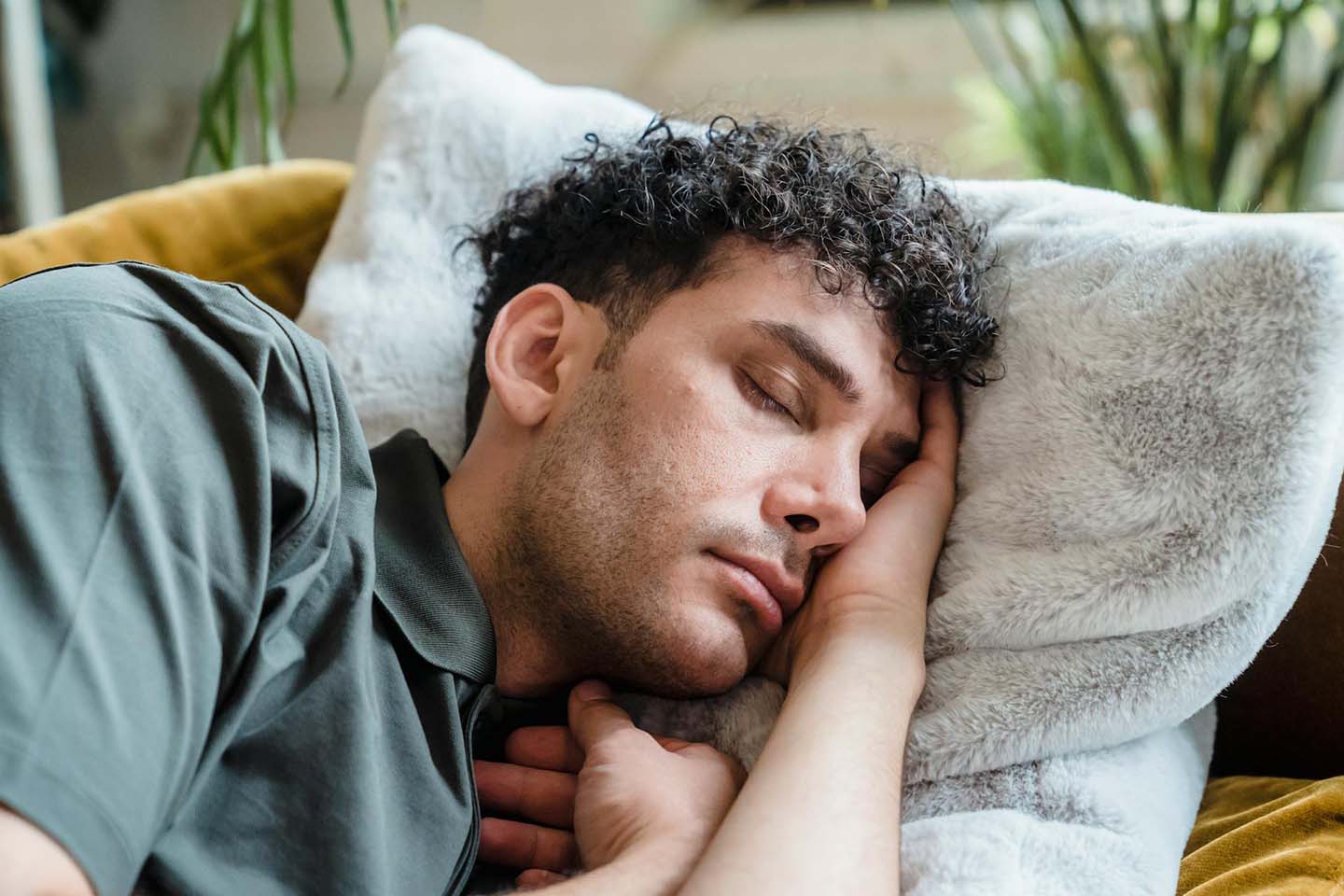 man sleeping on a fluffy pillow