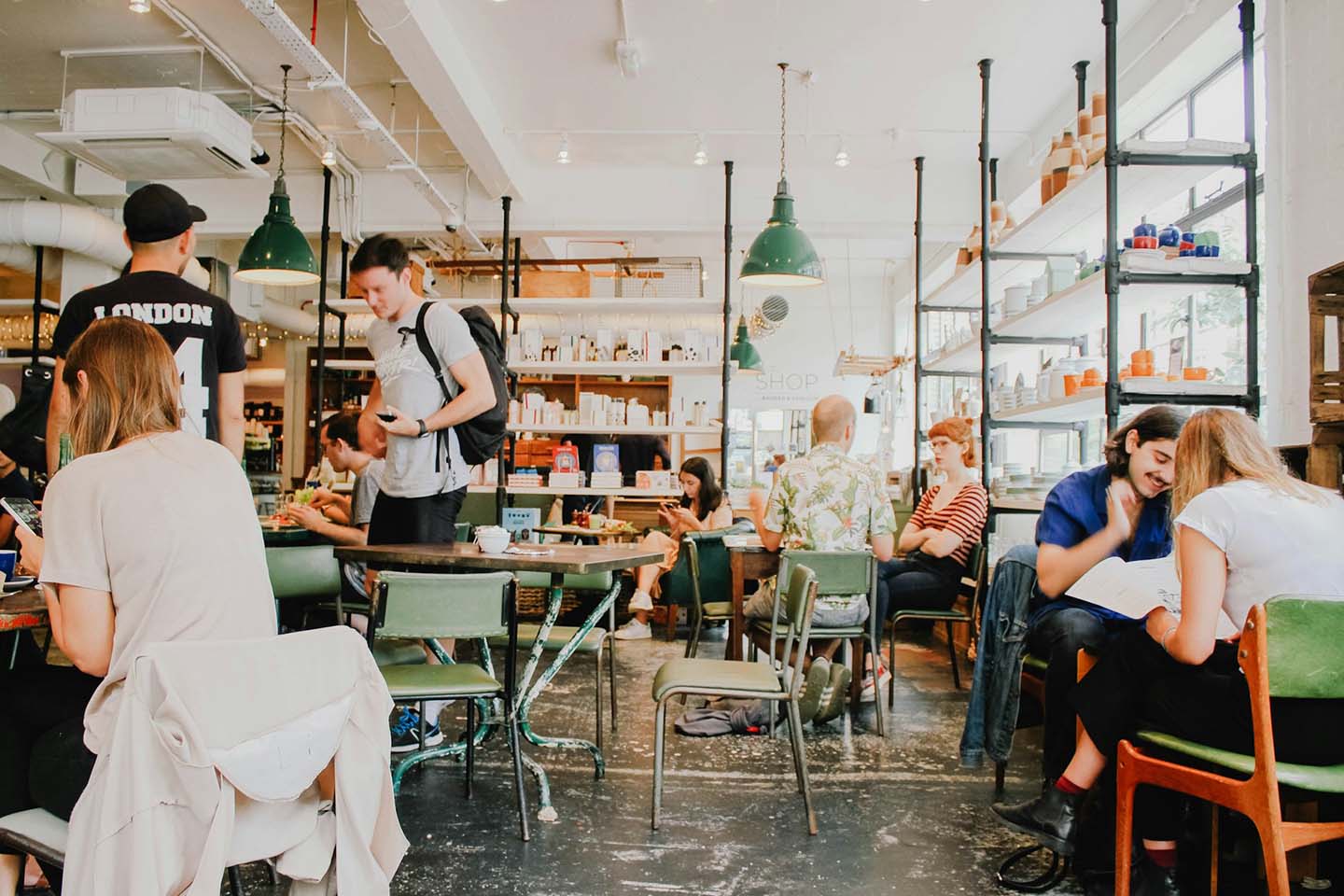 a busy cafeteria with people eating inside