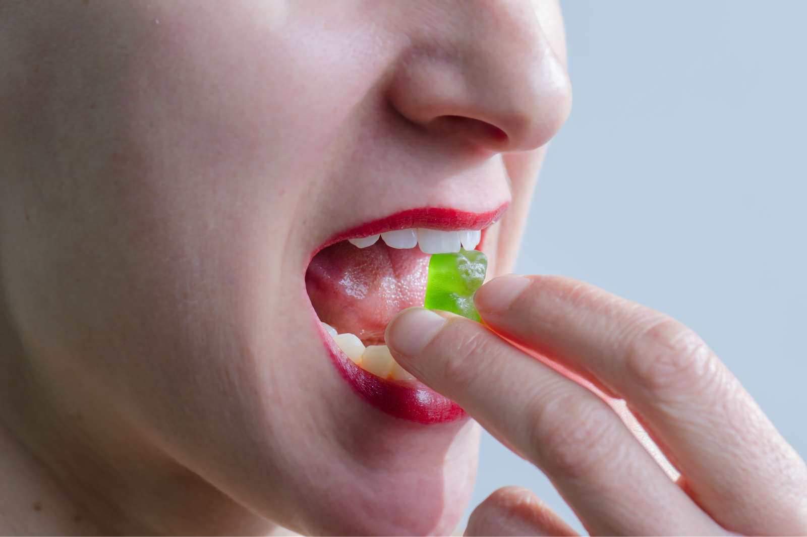 Woman eating a CBD gummy