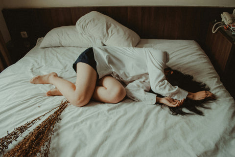 woman waking up on bed