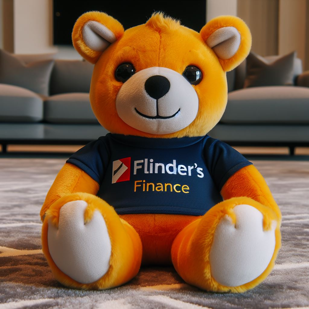 A custom plush toy mascot for a finance company. It is sitting on the floor wearing the logo on its t-shirt.