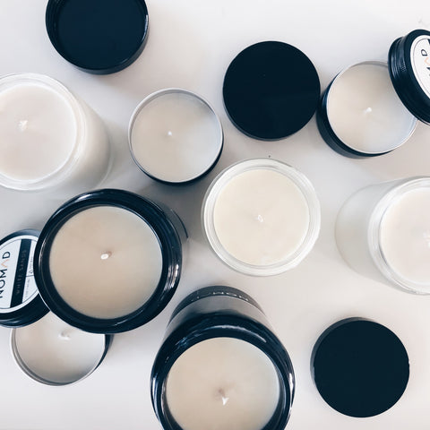 mix of Nomad Wax natural soy candles on white table
