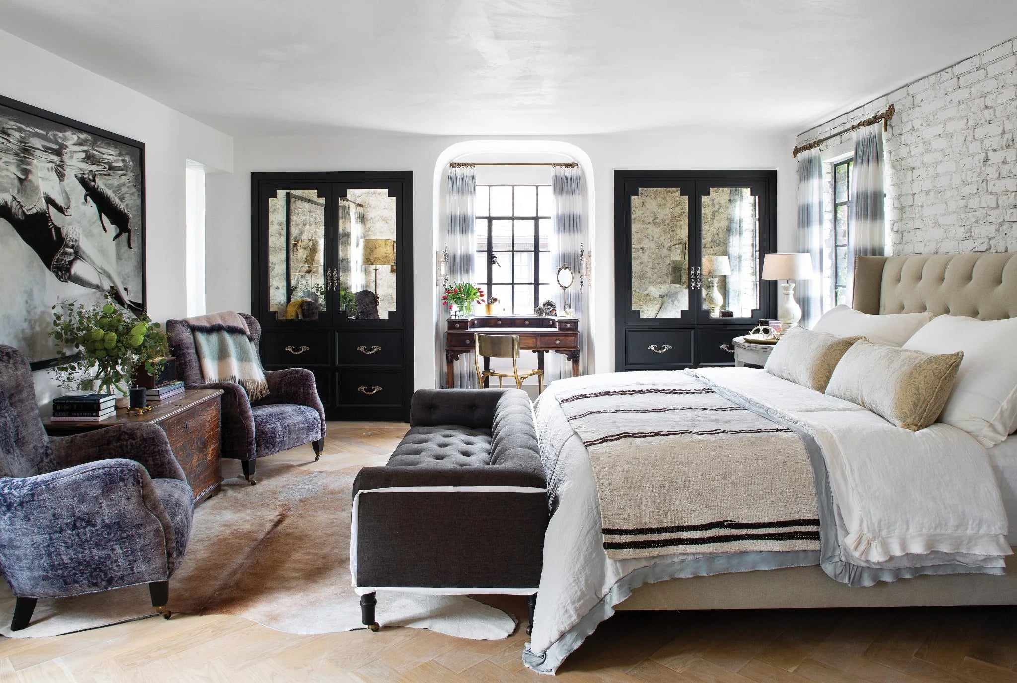 interior bedroom with cisco bed and two chairs