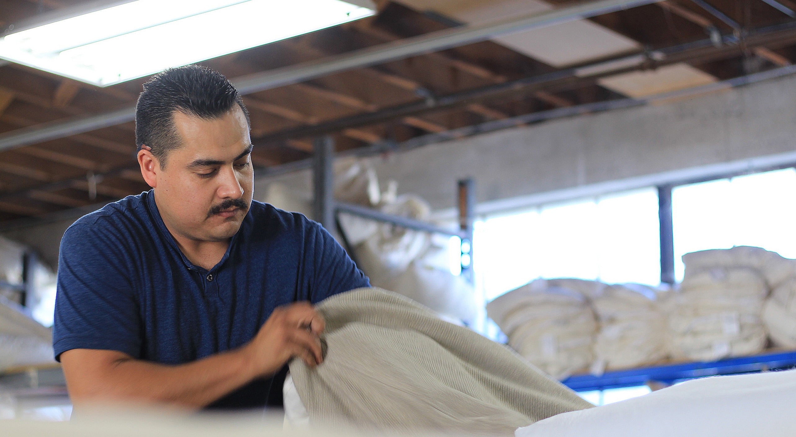 man packing cushion 