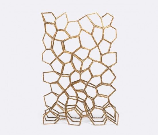 geometric patterned brass room divider