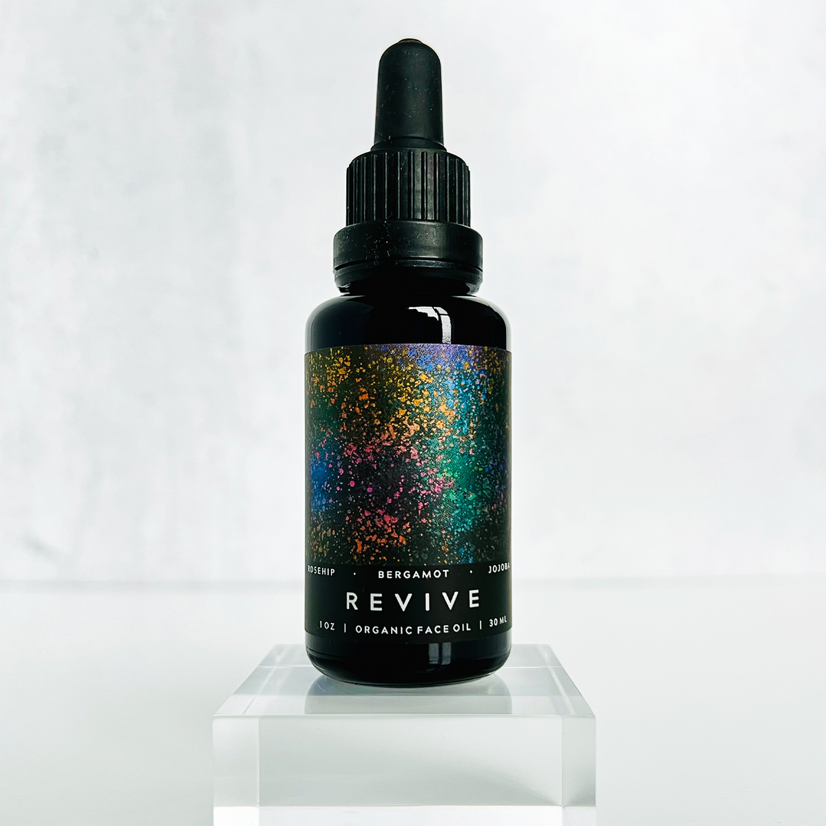 REVIVE Organic Face Oil design facing with lid