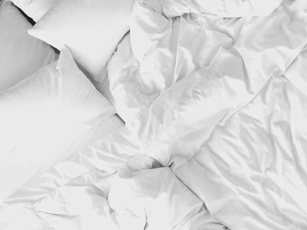Bed with white sheets