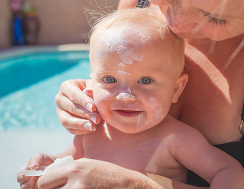 Baby outside with sunscreen
