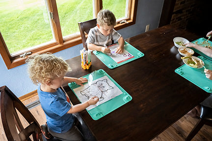 Toddler Boys drawing letters on the Busy Baby Toddler Mat