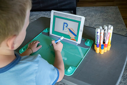 Boy drawing letters 