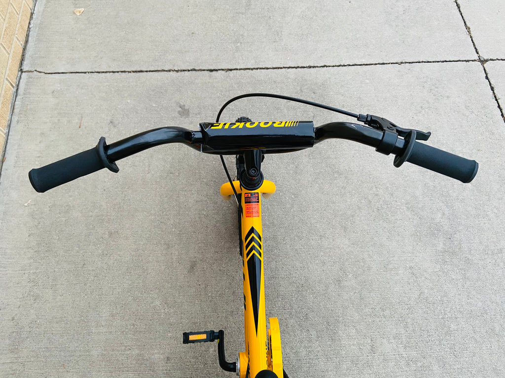 yellow bike with training wheels