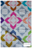 Modern lap quilt. Charmed quilt pattern by Lou Orth 
