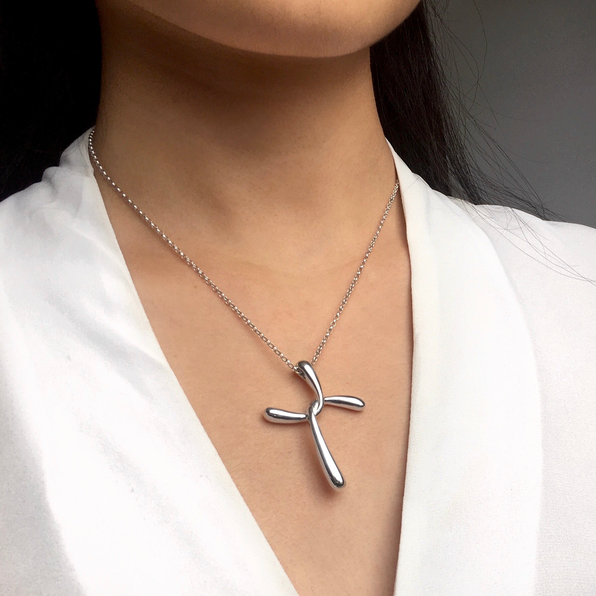 contemporary cross pendant