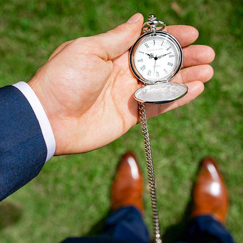 pocket watch on a man's hand