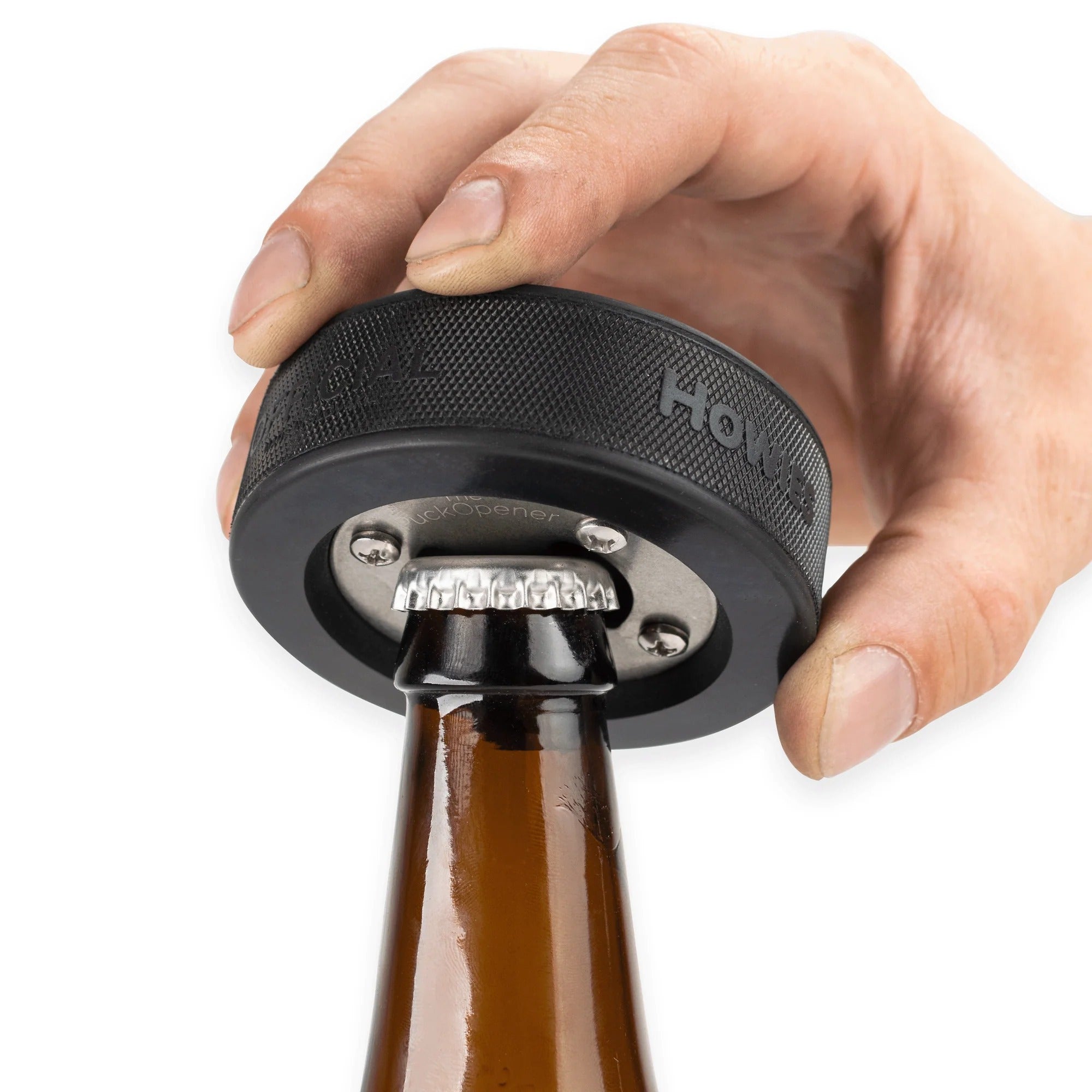 Open your next beverage with a uniquely designed hockey puck bottle opener