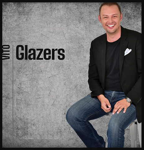 vito glazers sitting in front of gray background