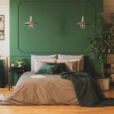 bedroom furniture with green linens