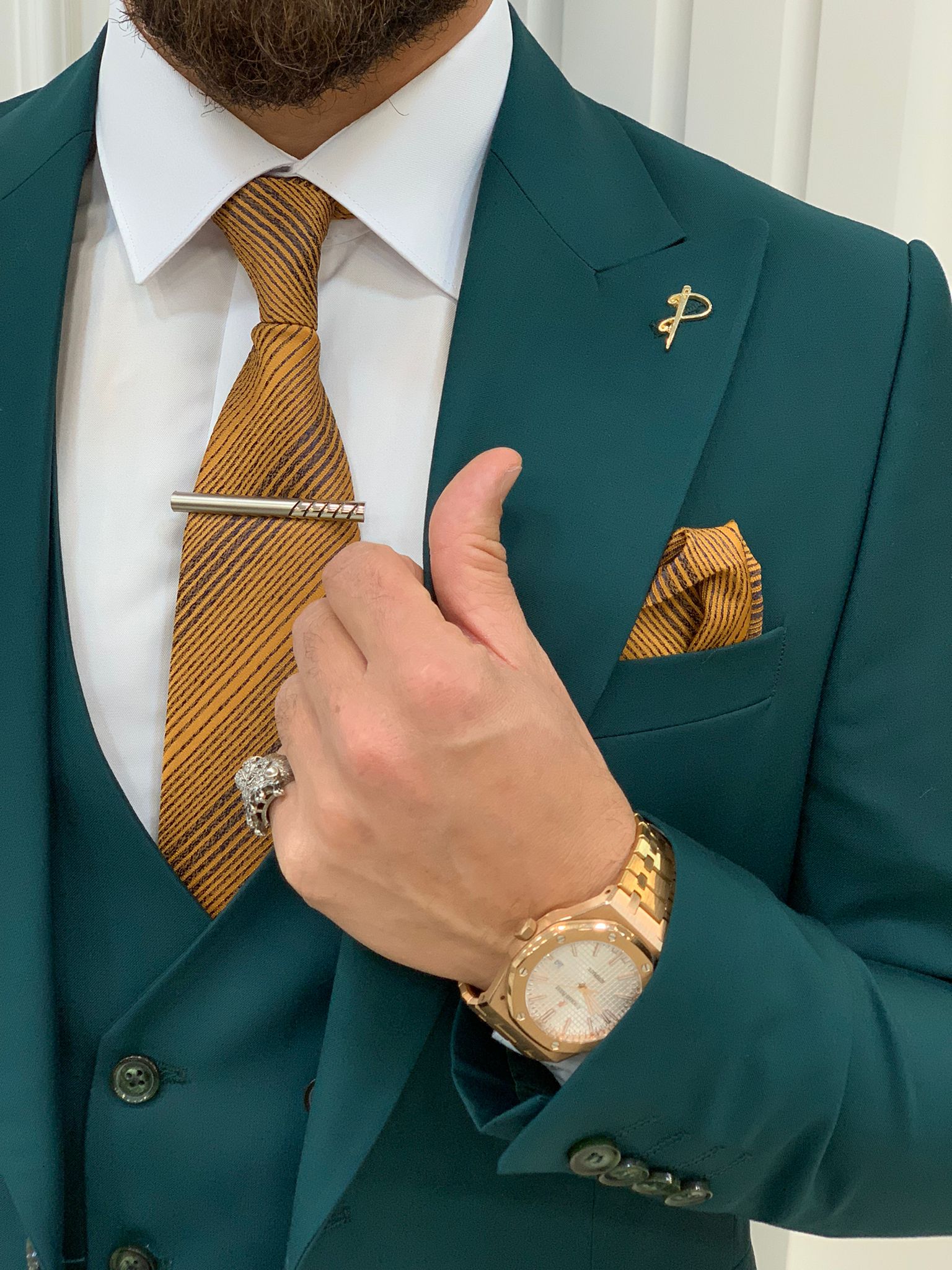 green suit gold tie