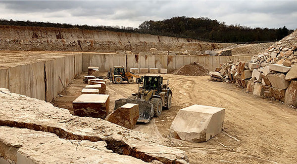 Limestone quarry with block moving equipment