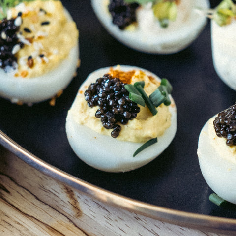 Deviled egg with Siberian Caviar, chives and cayenne Pepper