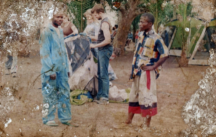 An old photograph from one of Robert's original trips to the DRC. You can see his son and wife in the background.
