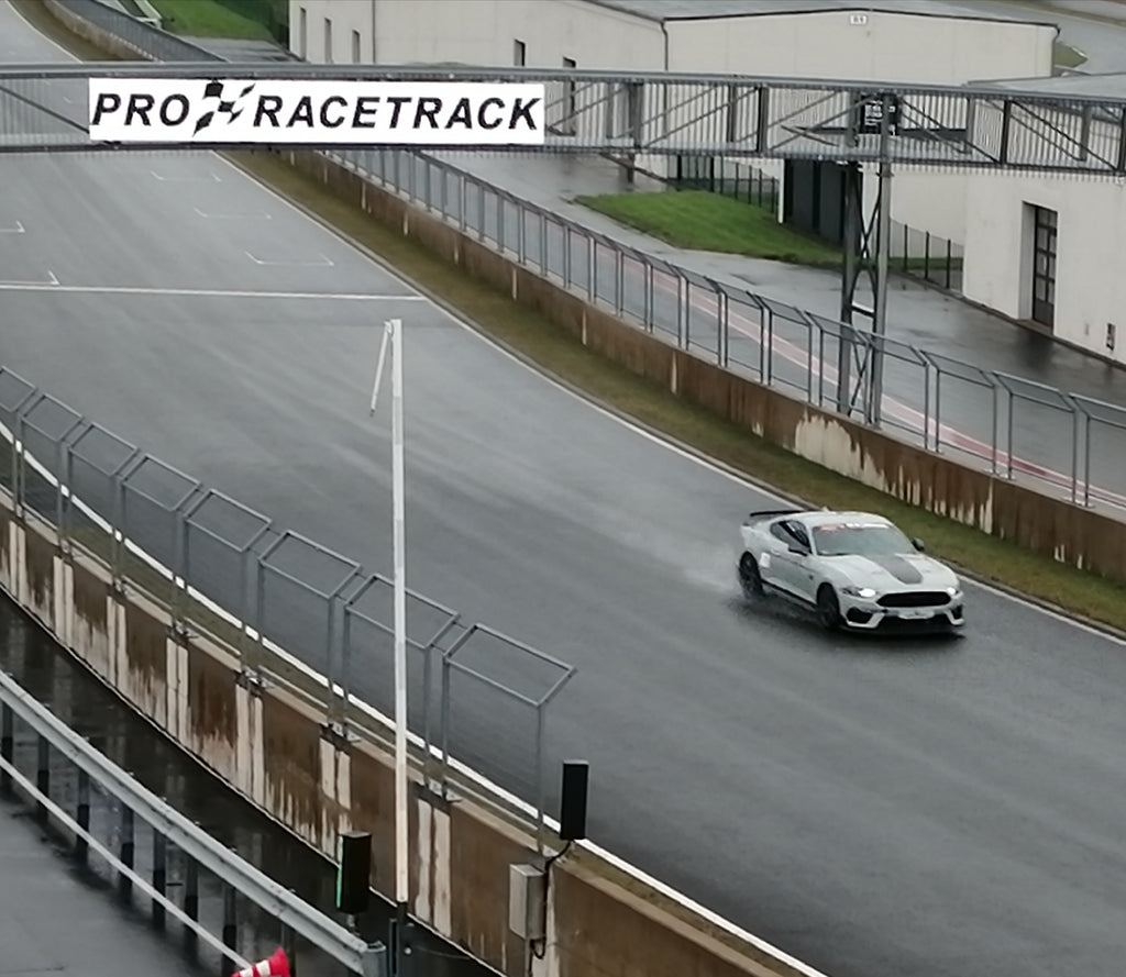 Steeda Q767 on WET home straight on Pro Racetrack Bilsterberg track day