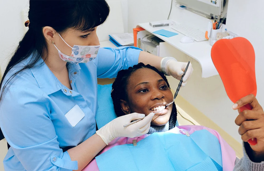 a dentist wearing gloves during a procedure