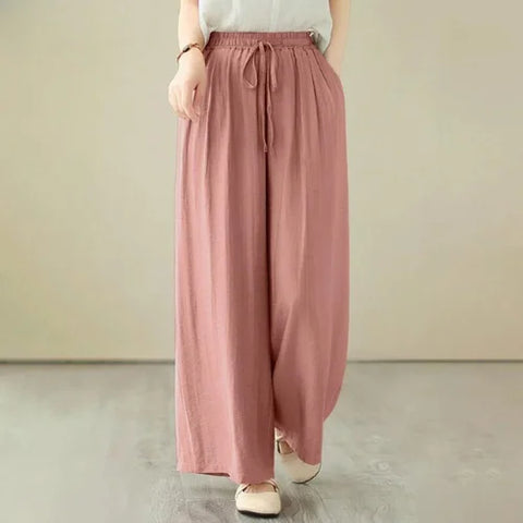 Calça Pantalona Wide Leg: Linho premium, cintura elástica, bolsos laterais. Elegância e conforto em cada detalhe