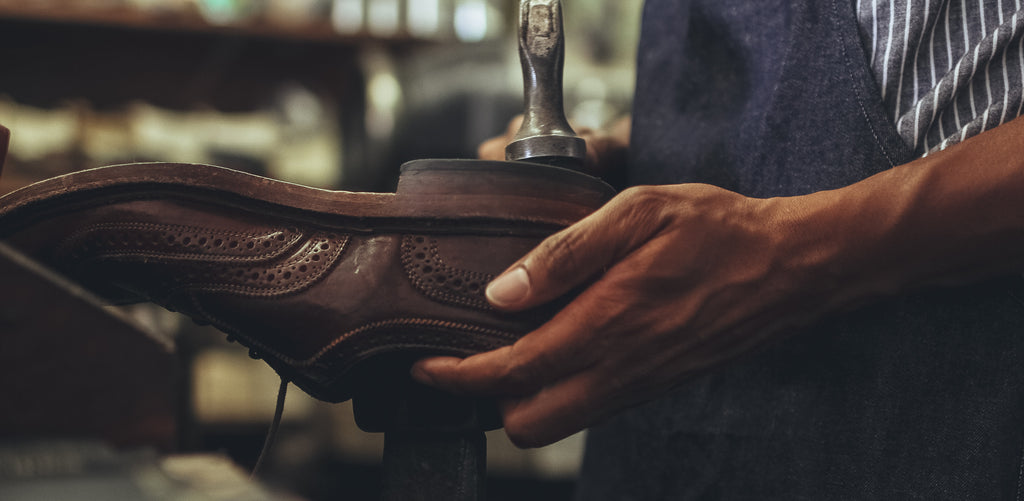 Crooks cobbler repairing shoes