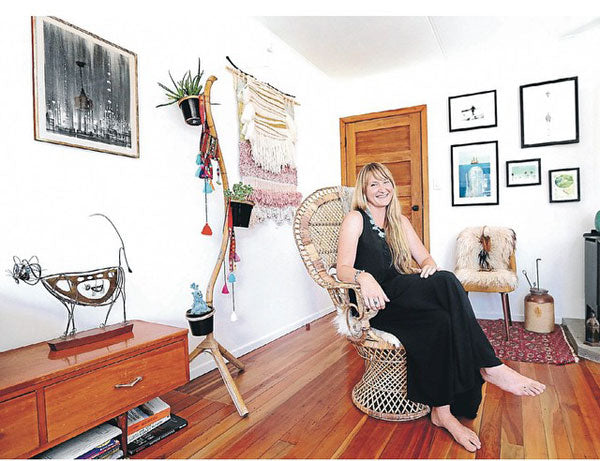 Arielle in her home - image Taranaki Times paper