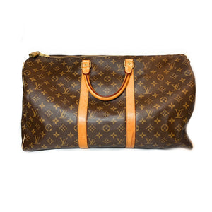 LOUIS VUITTON. Hunting bag in monogrammed canvas and lea…