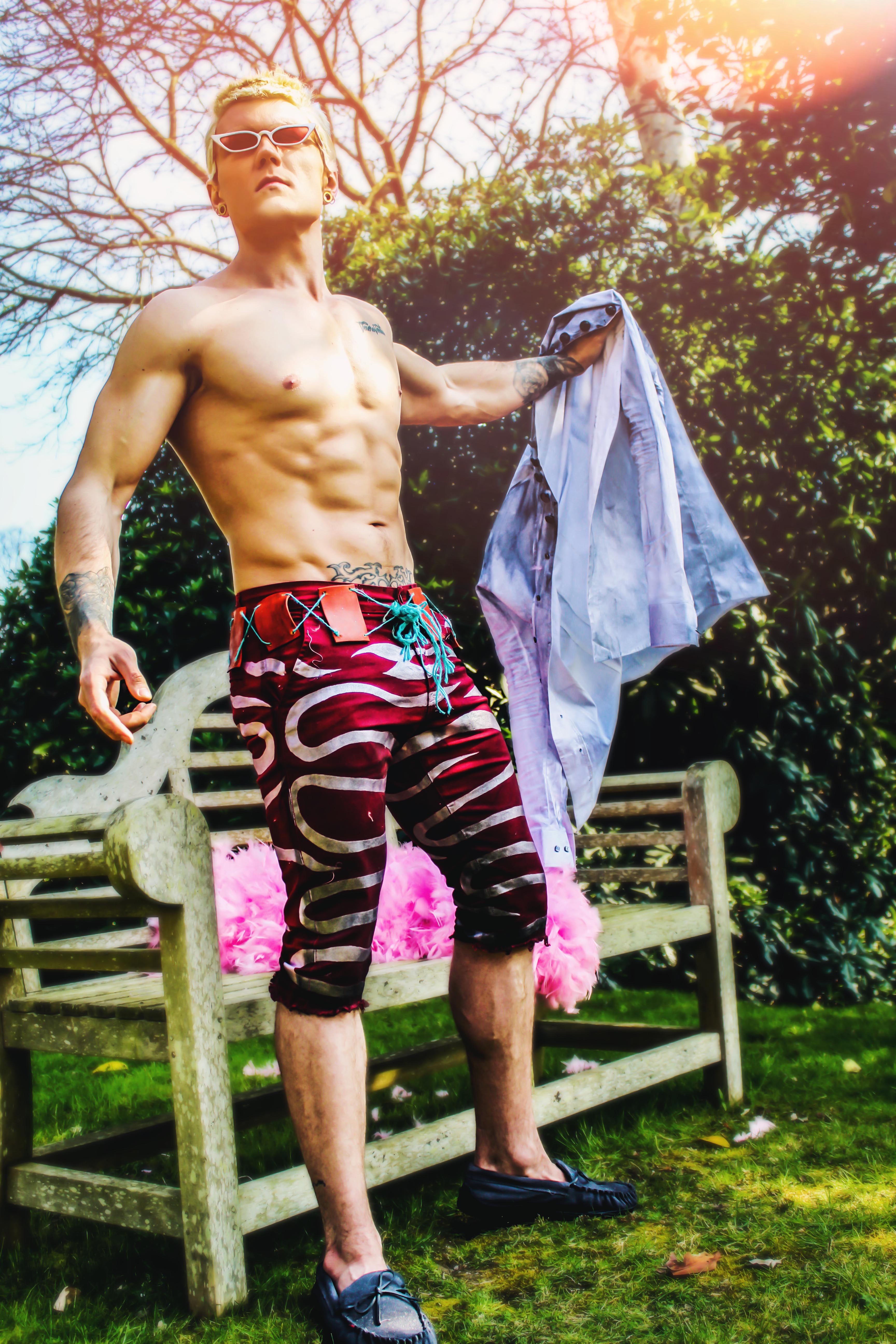 Doflamingo cosplay taking his shirt off