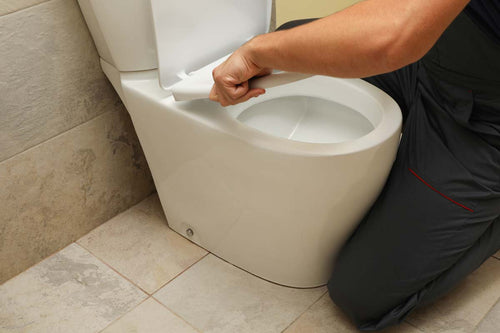 the-plumber-in-overalls-fixes-the-toilet-2022-02-05-12-53-10-utc.jpg__PID:18f441ee-dd3b-45d8-9d93-f21f6ff56262