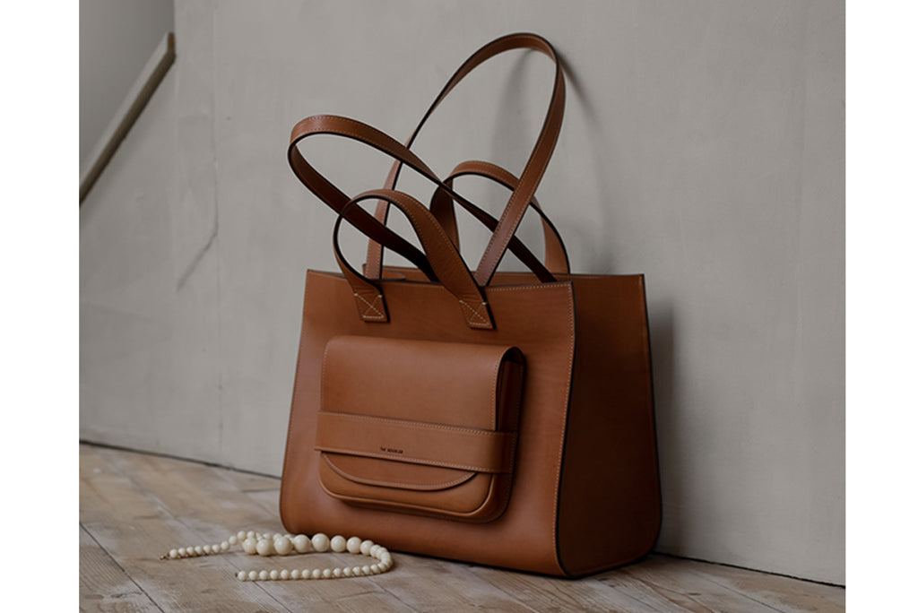 Tan leather 'Pioneer Tote' with showing double strap detail from THE REGULAR