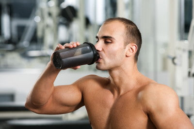 man eating protein shake