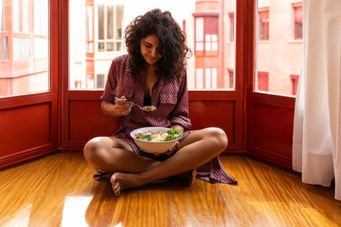 image of lady eating salad