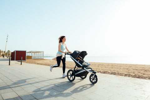 image of mother running with stroller