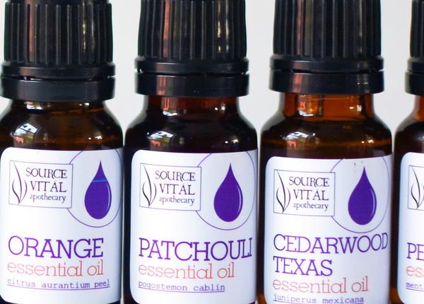 Source Vital Essential Oils lined up in amber bottles